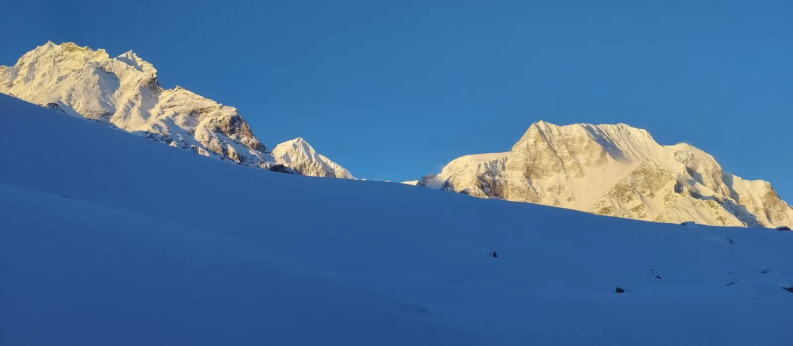 Sunrise catching the peaks around the Larkya La